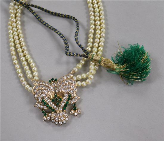 A triple strand cultured pearl necklace with yellow metal and paste set pendant, 42cm.